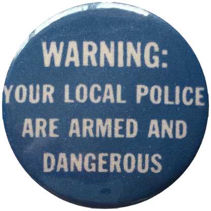 a vintage blue button with white text that says 'warning: your local police are armed and dangerous'